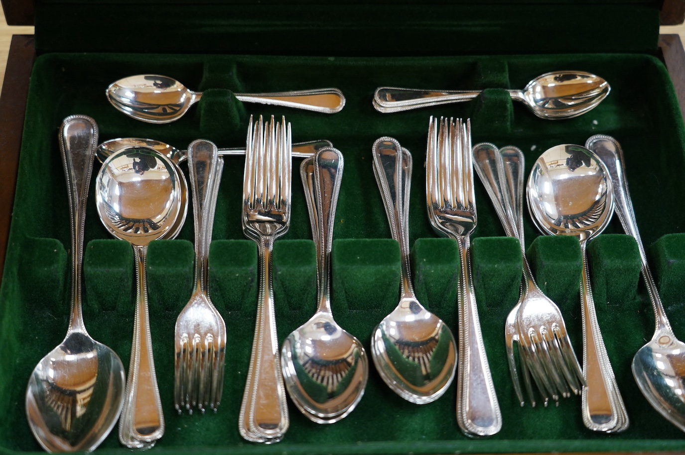 A silver plated canteen, settings for six, canteen 40cm wide. Condition - fair to good